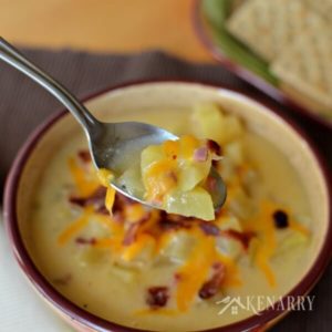 Slow Cooker Potato Soup - a creamy comfort food loaded with ham, bacon, cheese and lots of potatoes. You can easily make this yummy soup in your crockpot or slow cooker.