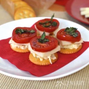 I love caprese salad with tomato, mozzarella, basil and balsamic vinegar! This easy appetizer takes it to the next level by adding chicken and putting it on a delicious RITZ® Cracker. #PutItOnARitz #Ad