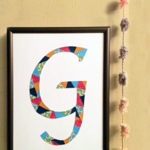 DIY initial art created with cut paper