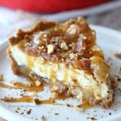 Homemade Caramel Apple Cheesecake on a graham cracker crust, filled with sweet, juicy apples and creamy caramel. It's the perfect finish to any fall meal!