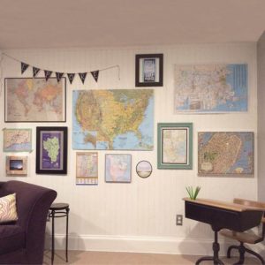 Create a gallery style wall with maps and travel related quotes
