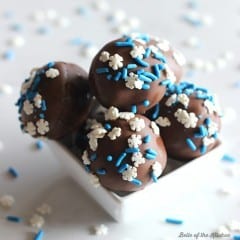 These Chocolate Cake Balls are made with crumbled cake and chocolate frosting, then dipped in melted chocolate and covered with sprinkles. They're the perfect treat for the holidays, or any time of year!
