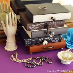 Make an Anthrolopogie inspired topsy-turvey jewelry box with vintage knobs. We'll show you how to stencil through lace to add a feminine touch!