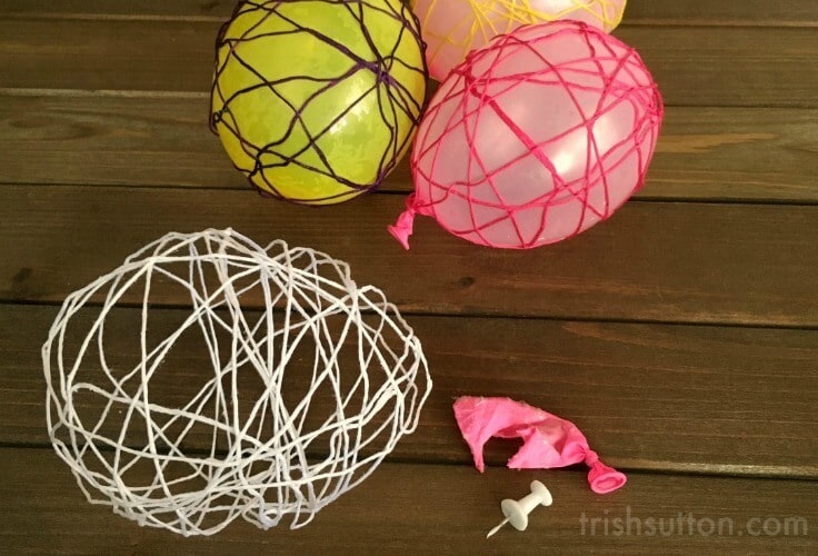 Colorful DIY Spring Decor: String Easter Eggs can be used as a table centerpiece, placed on bookshelves individually or they can be strung as garland.
