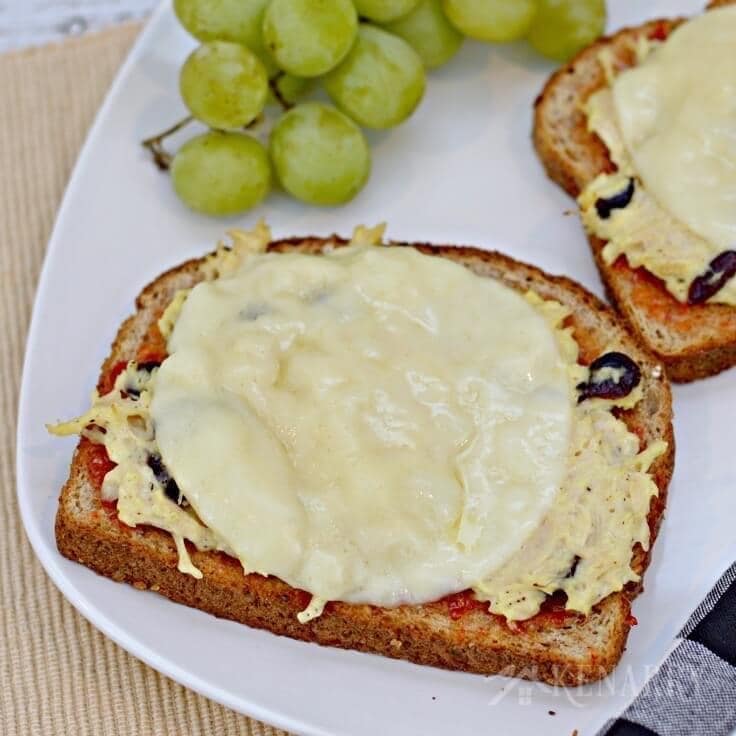 For an easy weeknight dinner idea, make this cheesy chicken melts recipe with canned chicken, red pepper jelly, dried cranberries and 100% real, natural sliced cheese from Sargento. #RealCheesePeople #ad