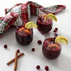This festive and colourful Holiday Sangria is a sweet wine cocktail loaded with fruit and spice. Make this budget-friendly drink ahead of time and then pull the pitcher out of the fridge just as guests are arriving.
