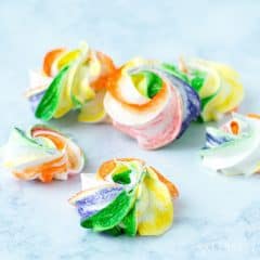 These simple and sweet Rainbow Meringues are a colorful, easy recipe idea for your next St. Patrick's Day party! They'd make the perfect treat for Mardi Gras or a birthday party too.