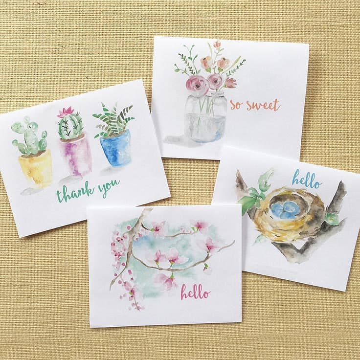Four white cards with watercolor spring flower illustrations.