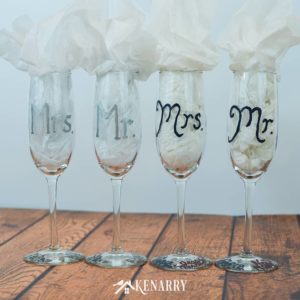 These Mr. and Mrs. toasting glasses are an easy DIY gift for the bride and groom. Personalized hand painted champagne flutes are the perfect DIY gift for a bridal shower, wedding or anniversary. #weddinggifts #weddingideas #weddingreception #handpainted