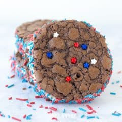 Need the perfect red, white and blue dessert idea for 4th of July, Memorial Day and Labor Day? Use a chocolate brownie mix and patriotic sprinkles to make the most delicious brownie ice cream sandwiches for summer. #4thofjuly #summerrecipes #memorialday #brownies