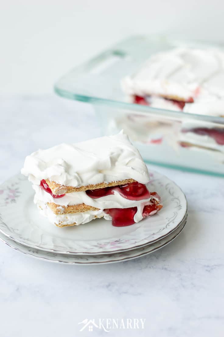 Use graham crackers and whipped topping to make this quick and easy No Bake Cherry Pie Ice Box Cake for your next outdoor picnic or potluck party. Your whole family will love this easy dessert idea for summer or anytime of the year!