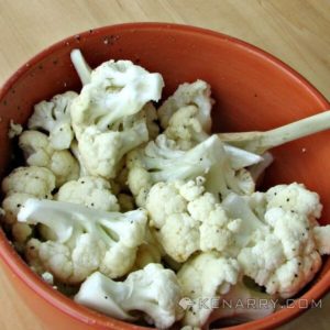 cauliflower pieces in a bowl with spices