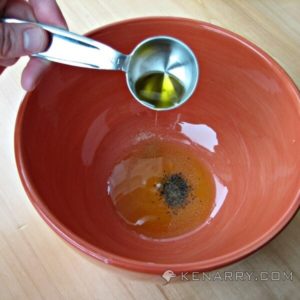 olive oil pouring into a bowl with spices