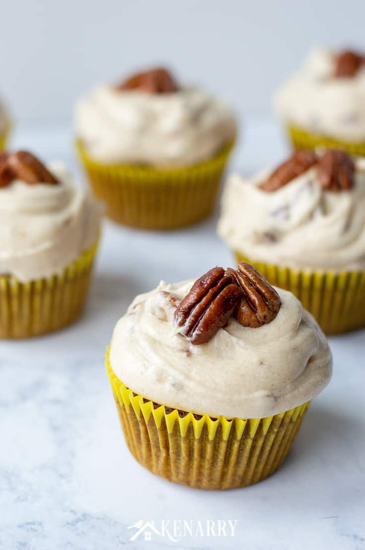 Need an easy dessert idea for a potluck or holiday party? These Easy Vegan Chocolate Cupcakes with Pecan Pie Frosting are sure to be the best crowd-pleaser. #vegan #vegandessert #kenarry