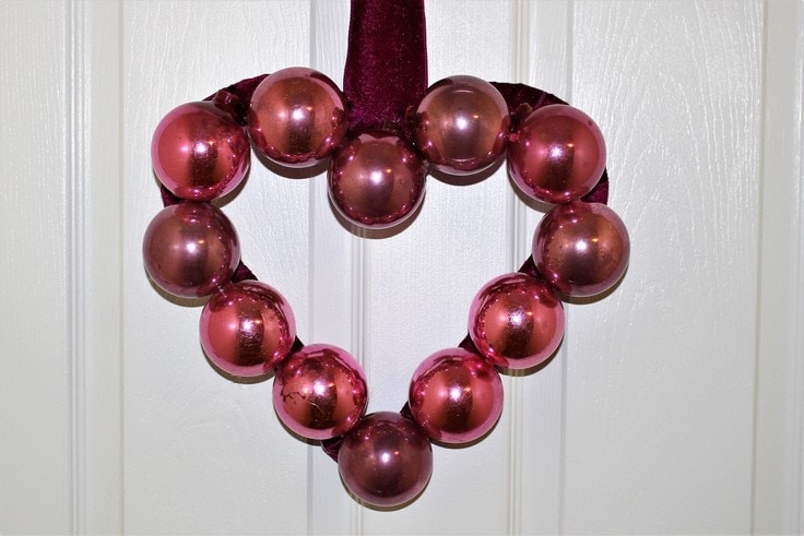 A heart-shaped wreath made out of ornaments 
