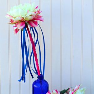 A close up of a ribbon flower wand