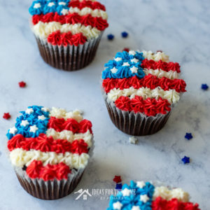 Frosting is used to make chocolate cupcakes look like American flags for the 4th of July