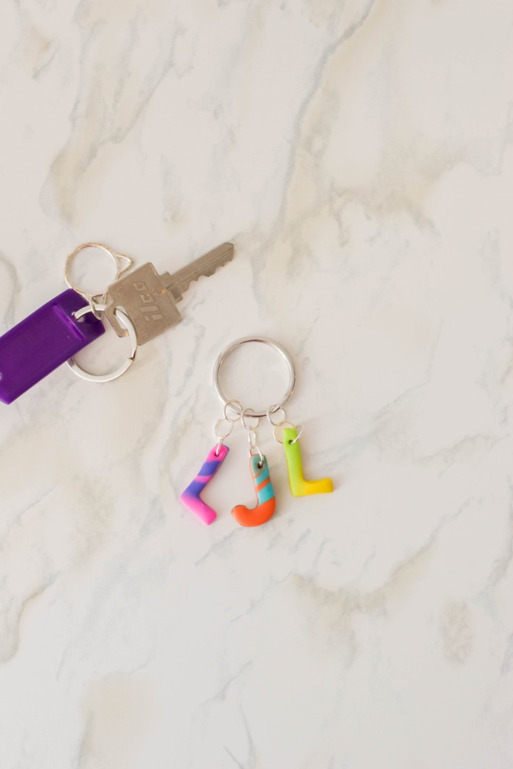Polymer clay key rings with letters L and J.