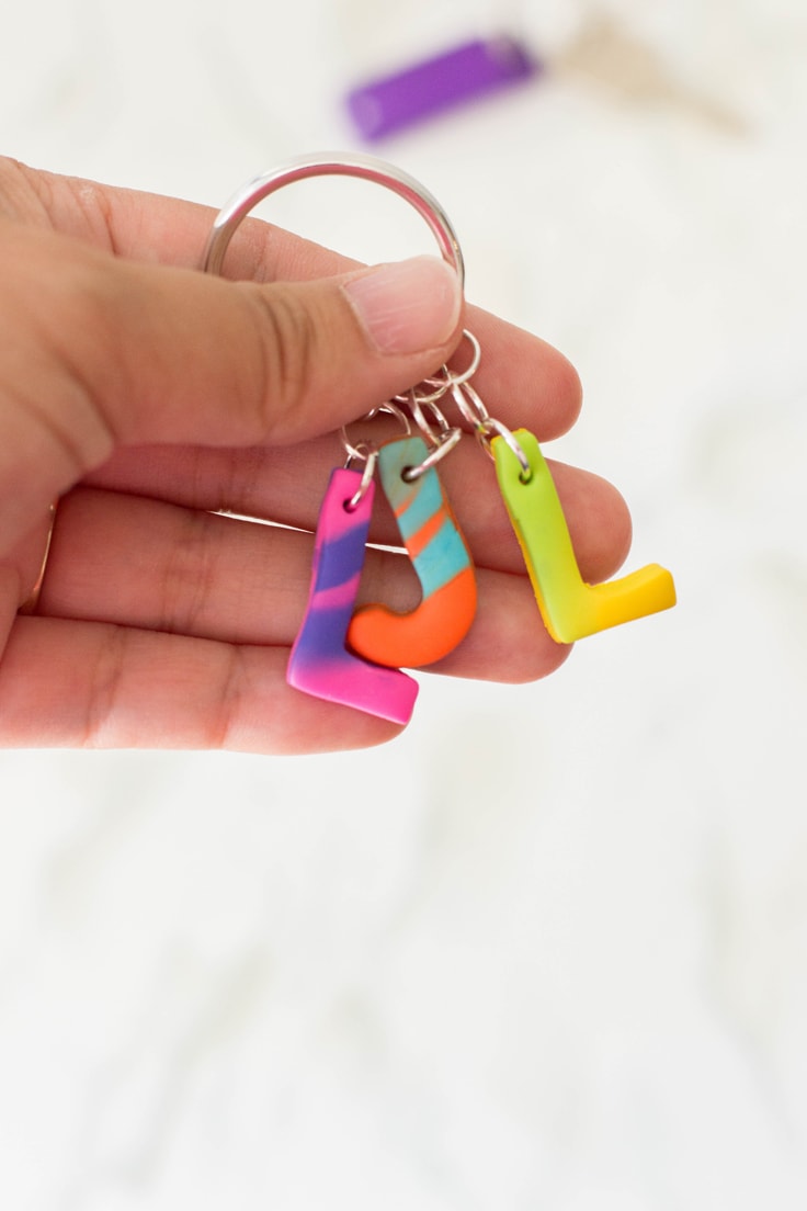 A close up of a personalized key chain made out of polymer clay.
