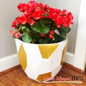 Style your front porch with this Front Door Flower Pot painted with a beautiful metallic gold paint.