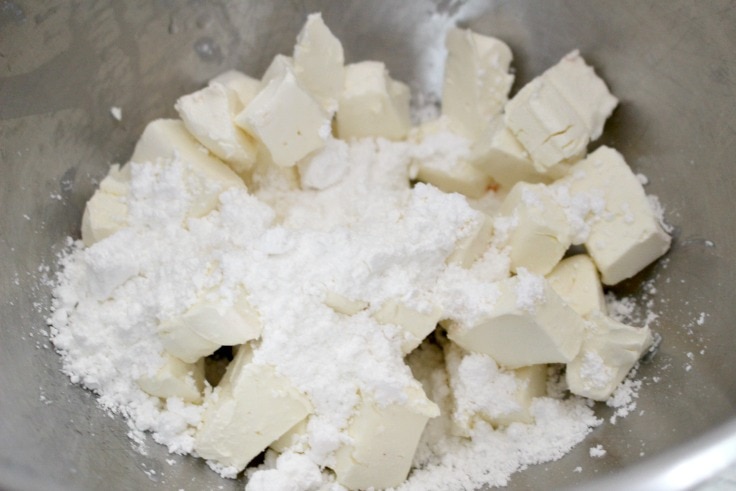 cubed cream cheese with powdered sugar