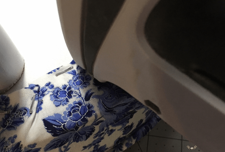 A close-up of floral fabric on a bar stool