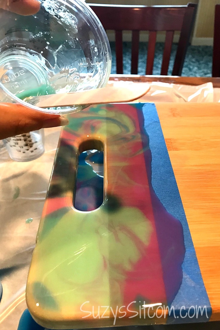 Pouring resin on a wood cutting board