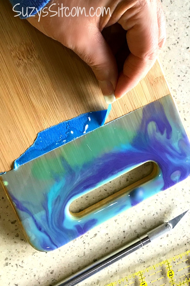 Peeling painte's tape off the wood cutting boards