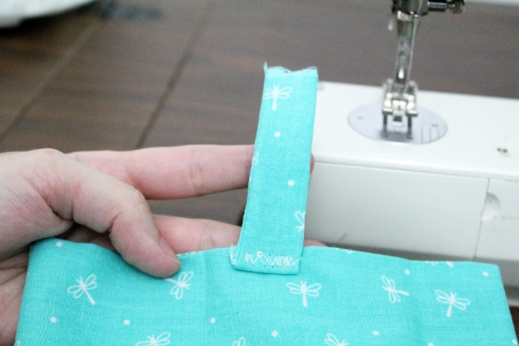 Attaching the closure piece to the iPad cover with a zigzag stitch