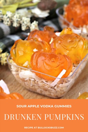 These Drunken Pumpkin Sour Apple Vodka Gummies are the perfect adult-only Fall or Halloween candy treat! Gummy pumpkins are infused with Sour Apple Vodka and served over a bed of sweet toasted coconut in this easy vodka gummies recipe. 