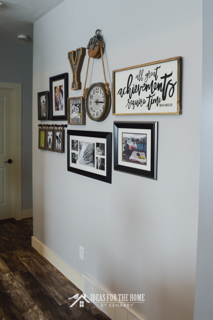 A collage of farmhouse style picture frames and home decor on a living room wall