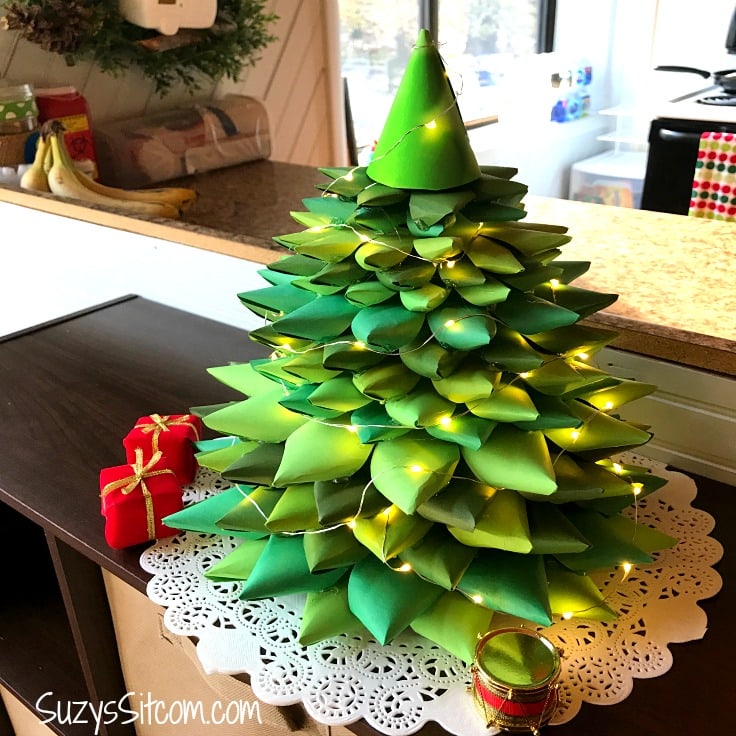 Create a beautiful holiday tree centerpiece with paper!  Simple paper folding tutorial.