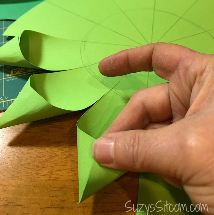 Fold the paper and glue them. 
