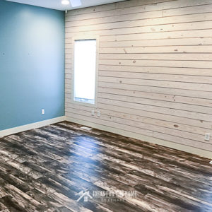 A blue room with a white shiplap wall - use this tutorial to learn how to make a shiplap wall
