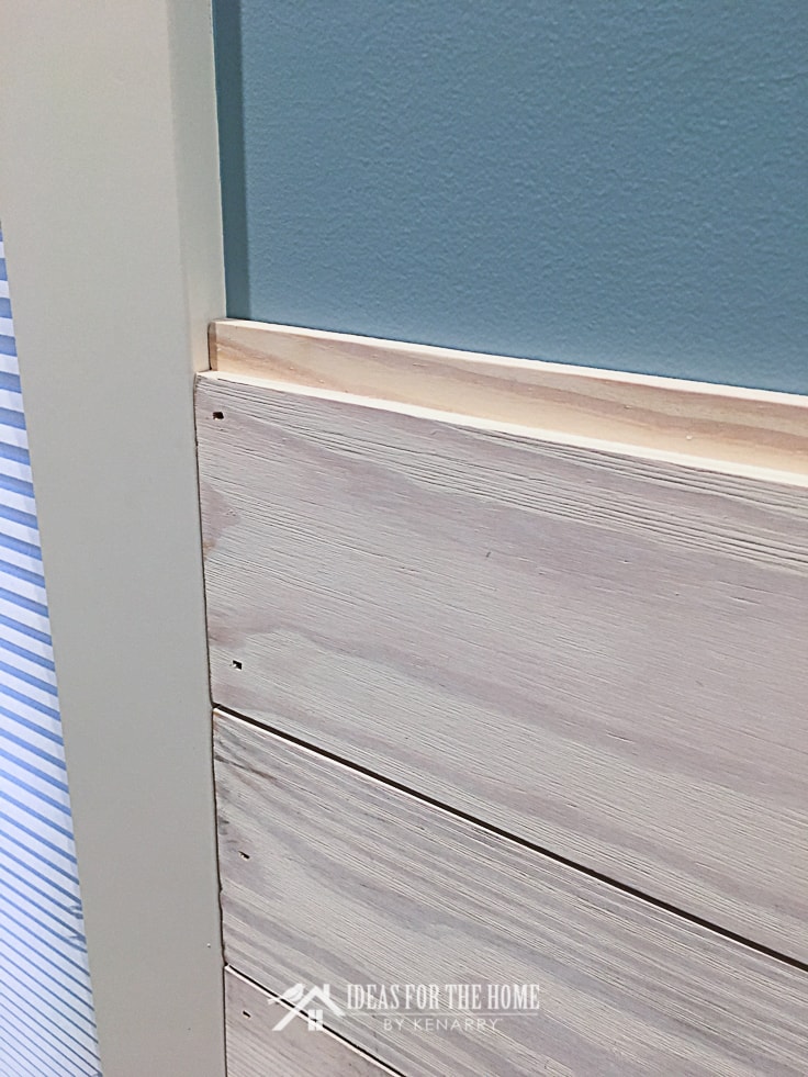 Close up of a shiplap wall being installed in a master bedroom