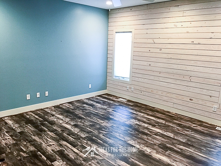 A blue room with a white shiplap wall - use this tutorial to learn how to make a shiplap wall