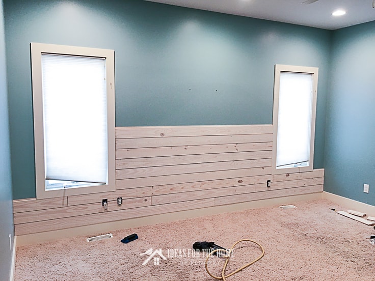 Installing a white washed plank wall in a bedroom