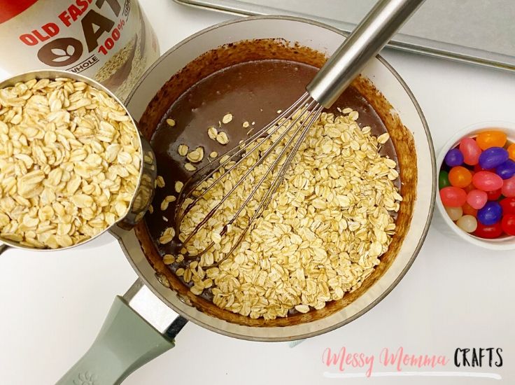 Once you remove the chocolate mixture off the heat, you can stir in the creamy peanut butter and mix in the oats next.