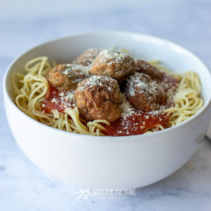 Learn how to make meatballs like these homemade italian meatballs served on a bowl full of spaghetti