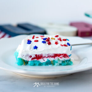 A delicious piece of red, white and blue layered jello cake for 4th of July