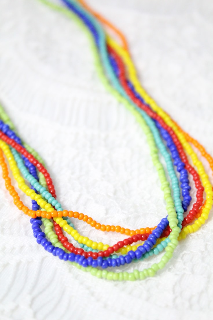 rainbow bead necklace on a white background