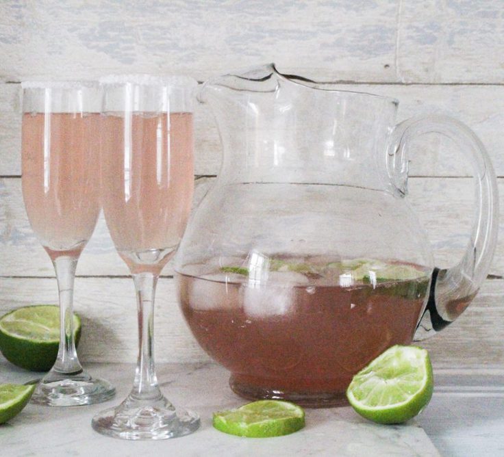 pink champagne margarita with glass pitcher