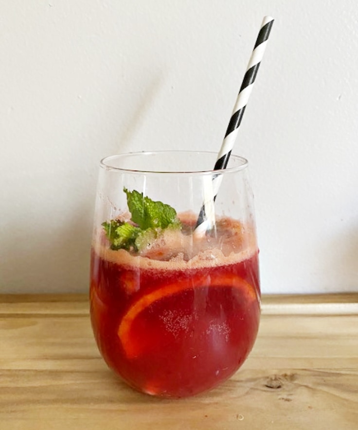 blood orange mimosa with  black and white straw