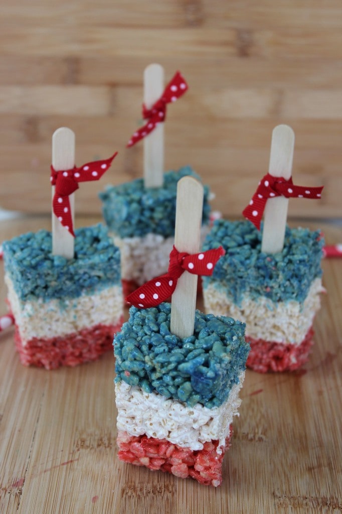 Red white and blue rice krispies treats with Popsicle sticks 