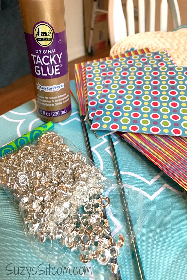 Tacky glue, scrapbook paper, and bead cores 