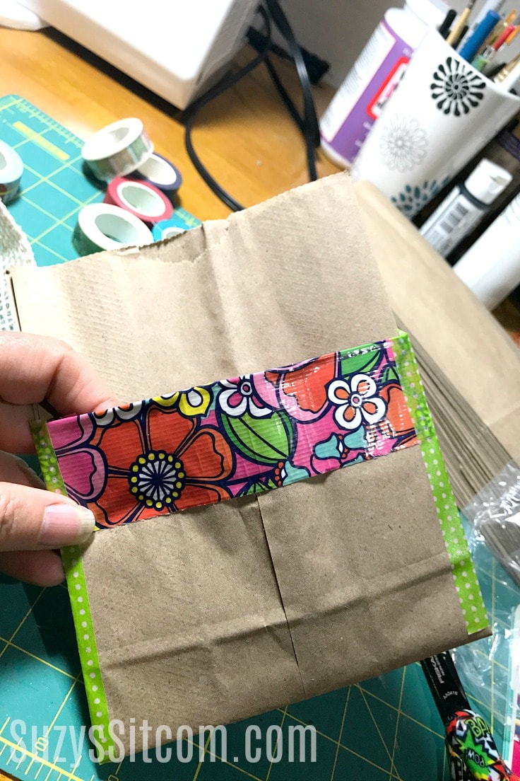 Duck tape and washi tape on a folded paper bag