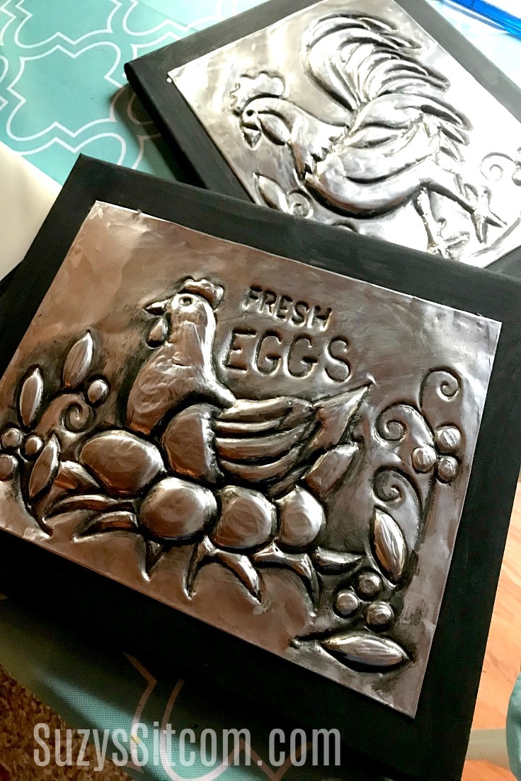 Embossed aluminum wall art of a chicken and a rooster