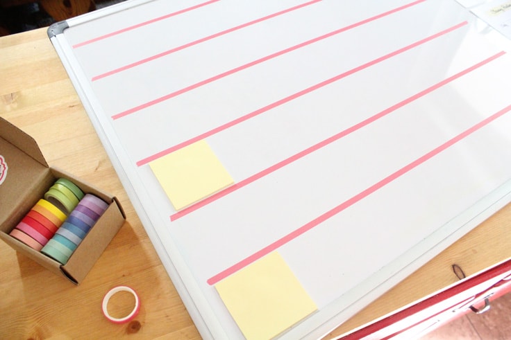 dry erase board with 6 rows of washi tape