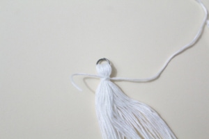 top knot of tassel tied with thread