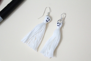 Finished pair of white ghost tassels for DIY Halloween earrings